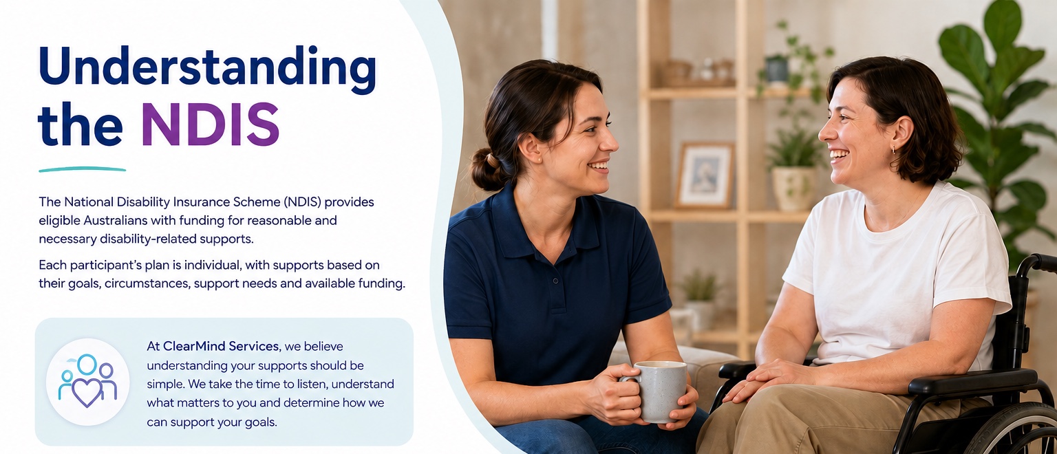 A ClearMind Services support worker sitting and talking with a participant who uses a wheelchair.